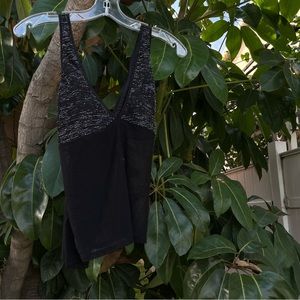 Black, cami-style, glittery, sheer tank with a stylish crisscross back.
